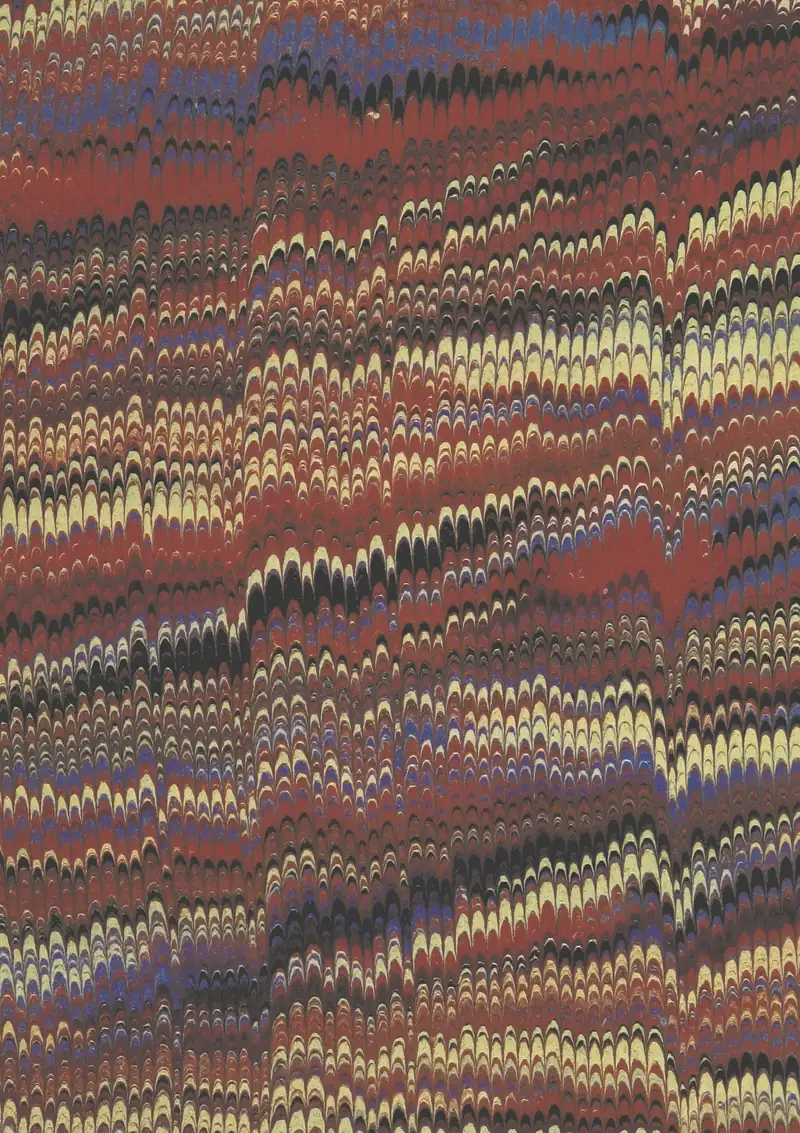 Papel marmoleado con vetas rojas, amarillas y moradas