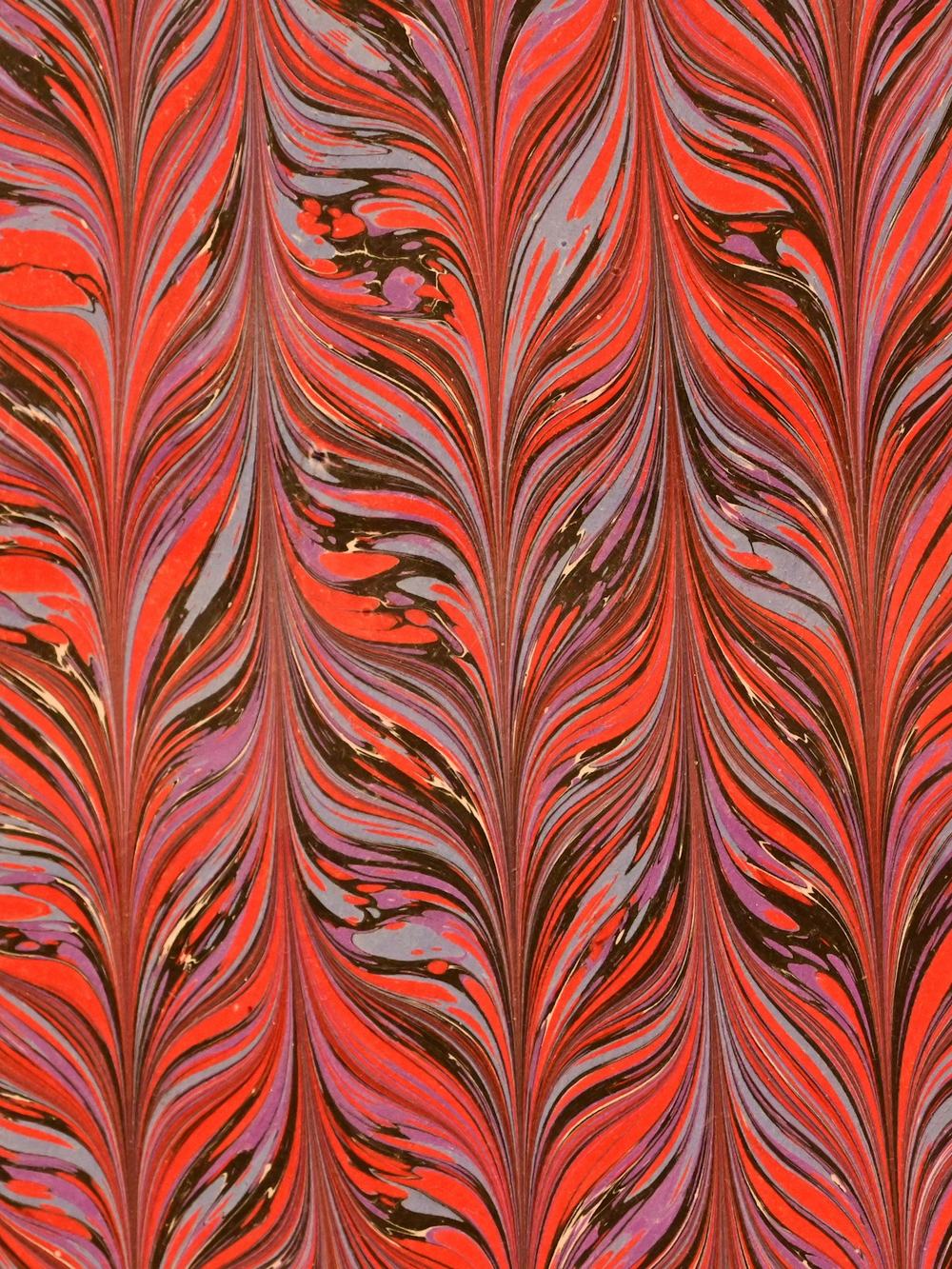 Papel jaspeado en rojos y naranjas