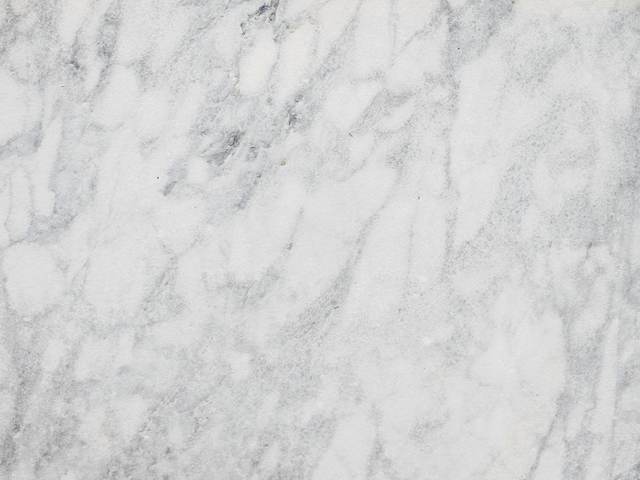 Superficie de mármol blanco con vetas grises