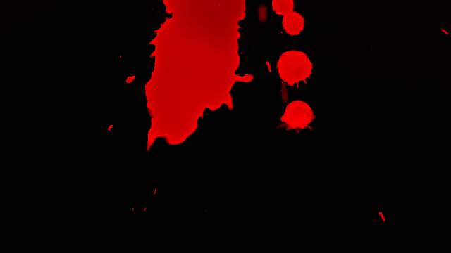 Gotas de tinta roja sobre fondo negro
