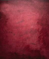 Fondo de rojo carmesí con manchas más oscuras hacia los bordes