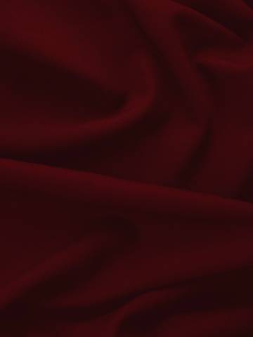 Pliegues suaves de terciopelo rojo oscuro