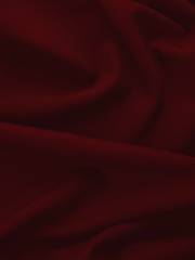 Pliegues suaves de terciopelo rojo oscuro