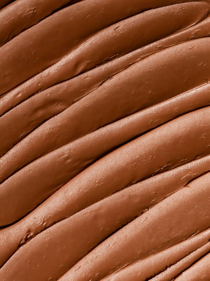 Textura de arcilla rojiza con surcos suaves