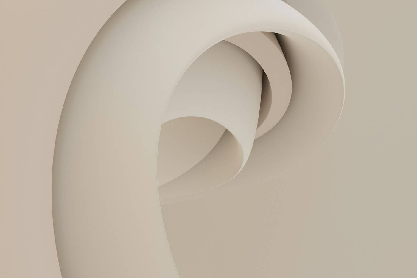 Formas curvas de papel beige, una dentro de otra