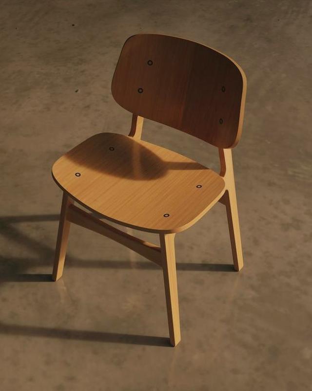Una silla de madera oscura sobre un suelo de cemento